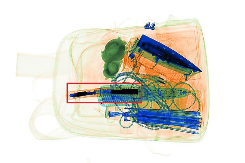 Image of an x-ray of a backpack with its contents